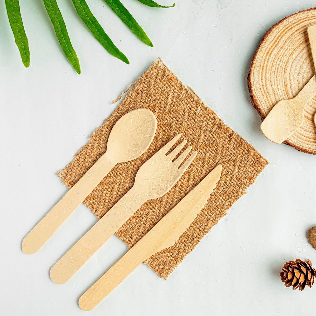 Bosnal Wooden Disposable Cutlery Set - 100 Pcs Biodegradable Compostable Utensils displayed on burlap.