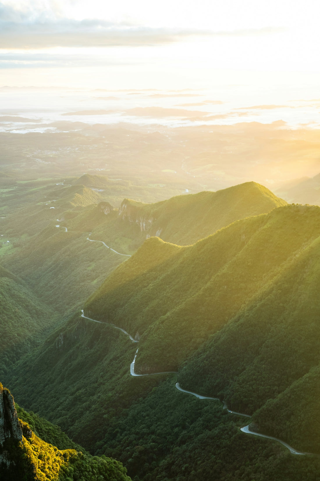green mountains under white clouds during daytime